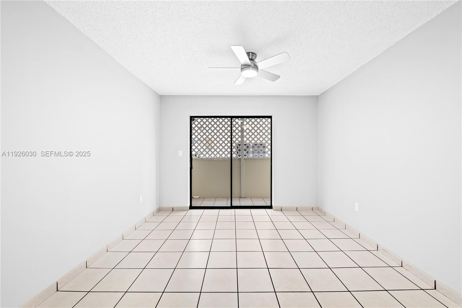 7915 Harding Avenue, Unit 1 Miami Beach, FL 33141 - Photo 4 of 25 a view of an empty room with a window