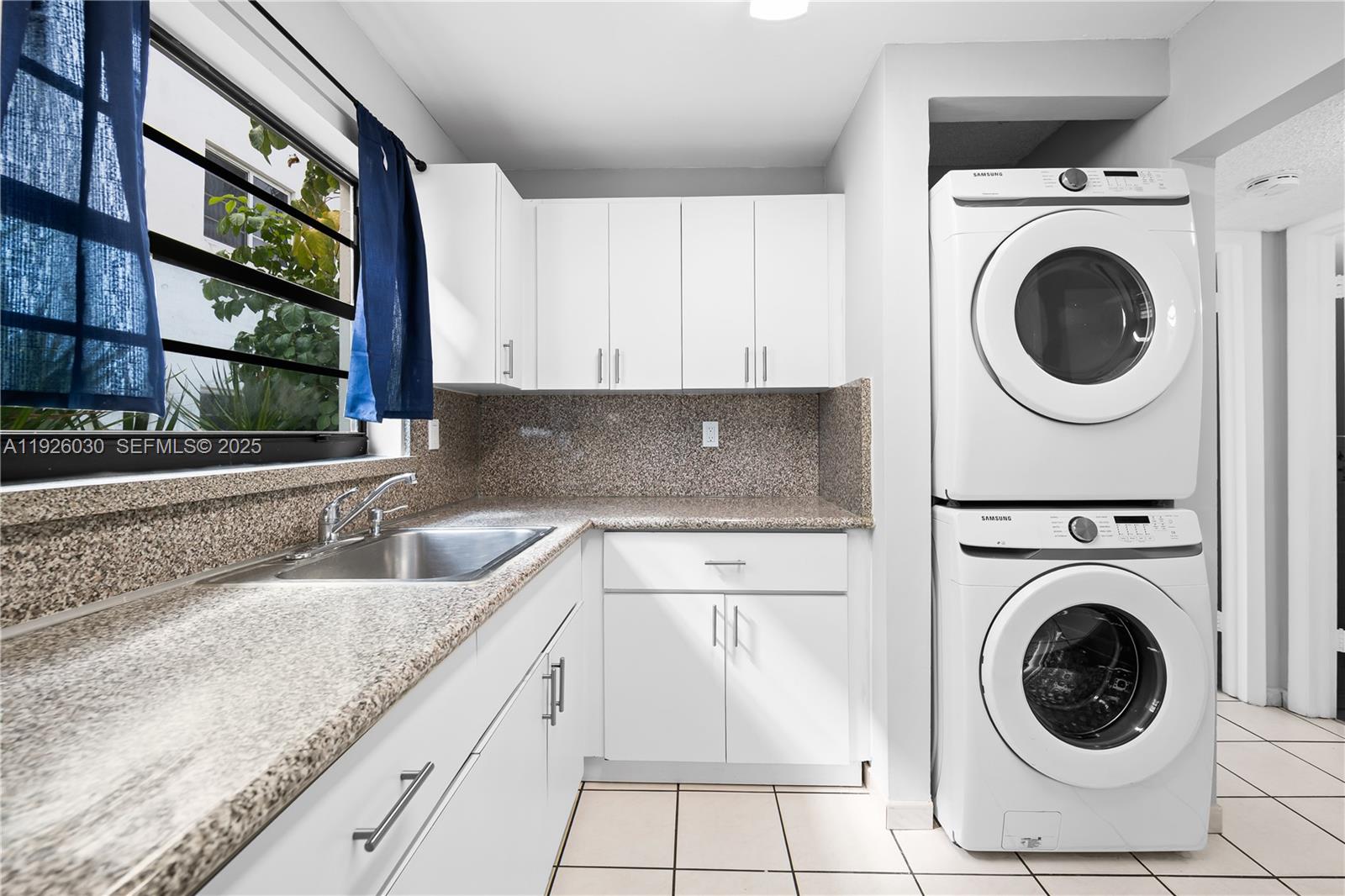 7915 Harding Avenue, Unit 1 Miami Beach, FL 33141 - Photo 8 of 25 a view of a kitchen with utility and utility