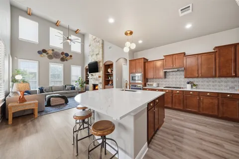 a very nice looking kitchen with a large window