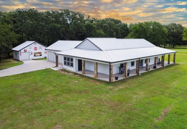a aerial view of a house with swimming pool
