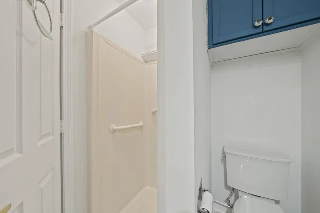 a bathroom with a shower and a sink