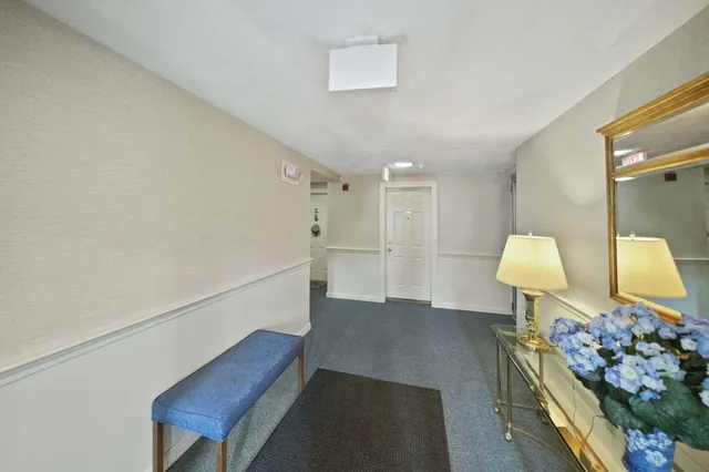 a view of an entryway with wooden floor