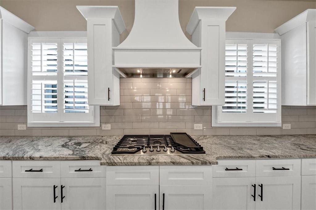 354 Oxford Road Ball Ground, GA 30107 - Photo 17 of 48 a kitchen with appliances cabinets and a window