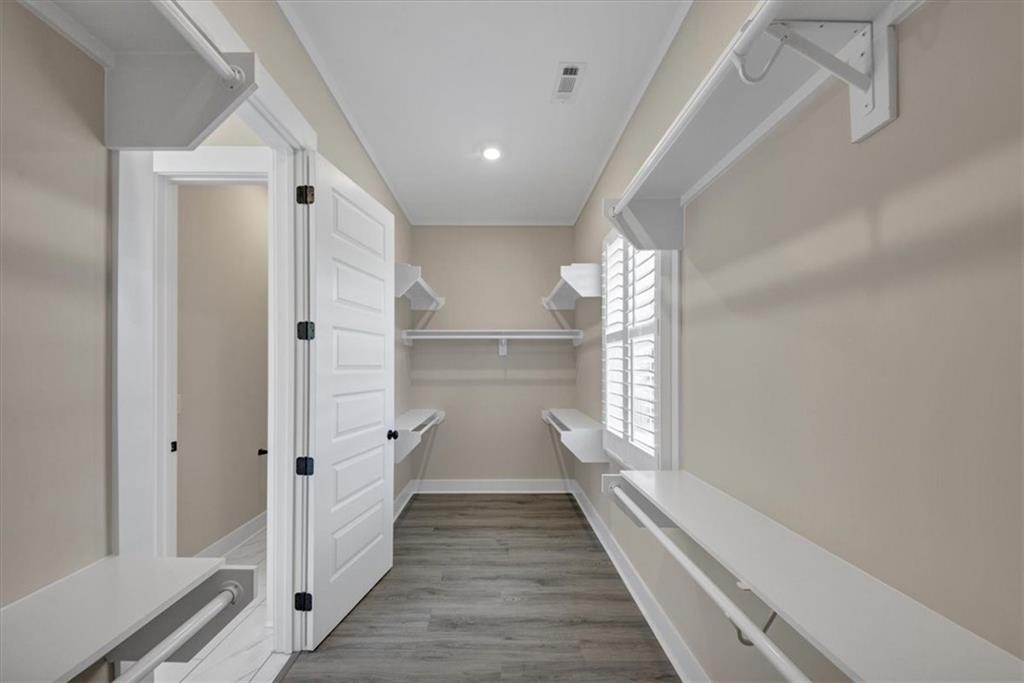 354 Oxford Road Ball Ground, GA 30107 - Photo 27 of 48 a view of a hallway with wooden floor and staircase