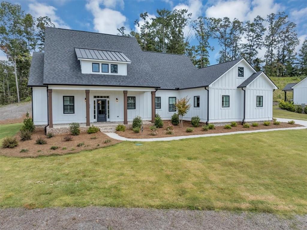 354 Oxford Road Ball Ground, GA 30107 - Photo 3 of 48 a view of a house with a swimming pool