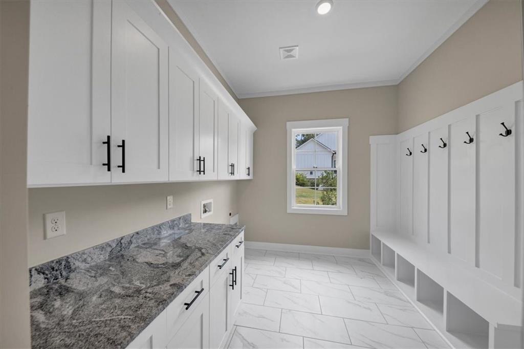 354 Oxford Road Ball Ground, GA 30107 - Photo 35 of 48 a kitchen with granite countertop a sink a stove and a refrigerator