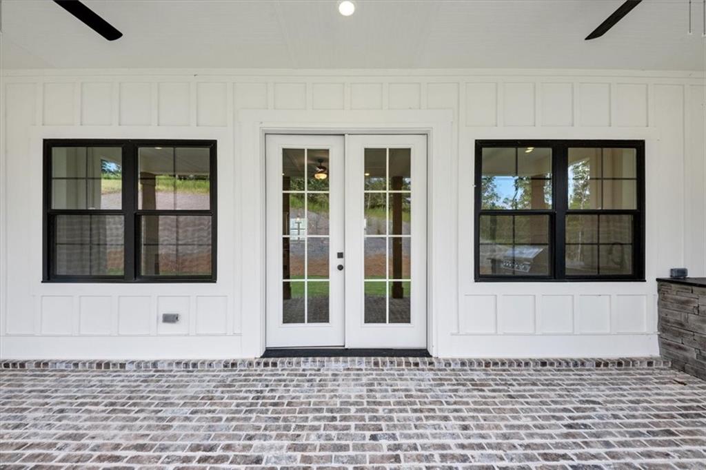 354 Oxford Road Ball Ground, GA 30107 - Photo 43 of 48 a front view of a brick house with a window
