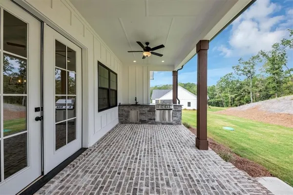 a view of a porch with wooden floor