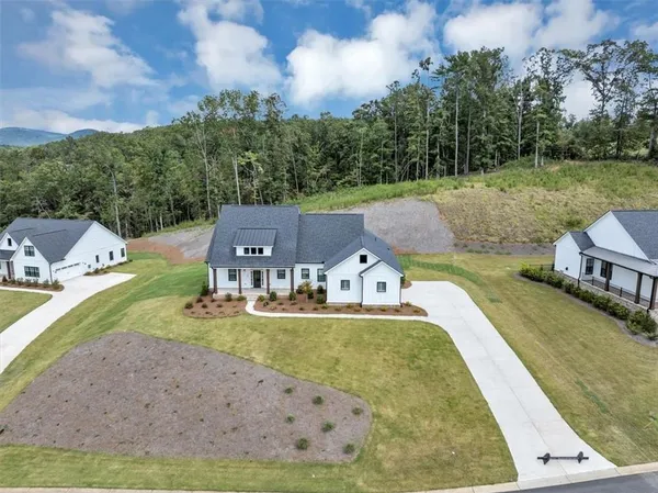 an aerial view of a house with outdoor space