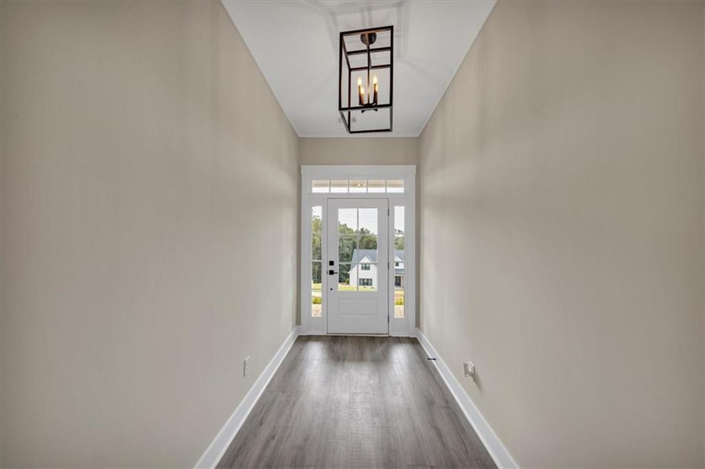 354 Oxford Road Ball Ground, GA 30107 - Photo 5 of 48 a view of an entryway with wooden floor