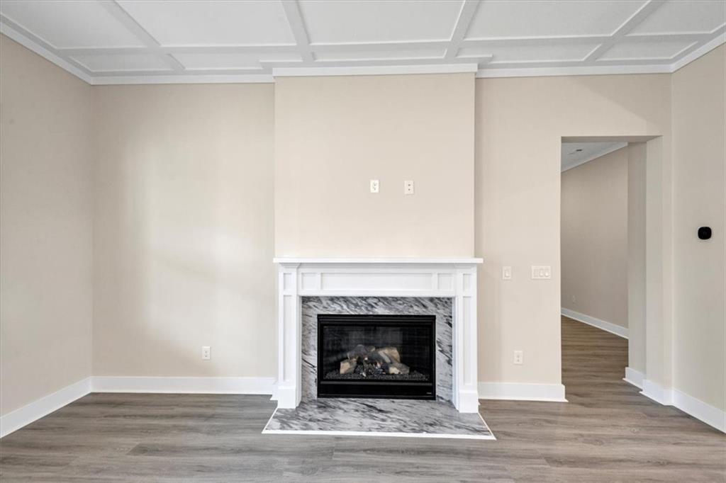 354 Oxford Road Ball Ground, GA 30107 - Photo 9 of 48 a view of a livingroom with a fireplace and a window
