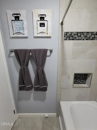 a bathroom with a bathtub and shower