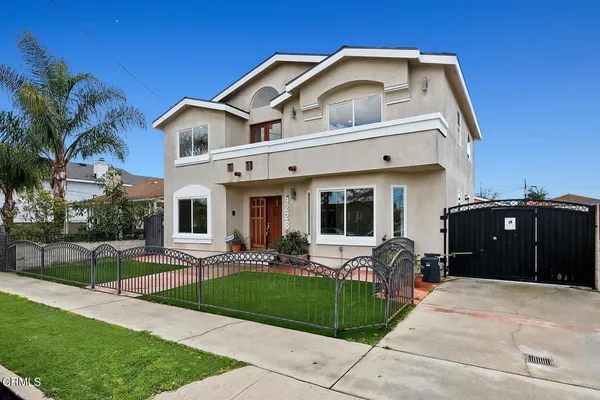 a front view of house and yard with green space