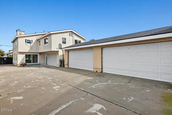 a front view of a house with a garage