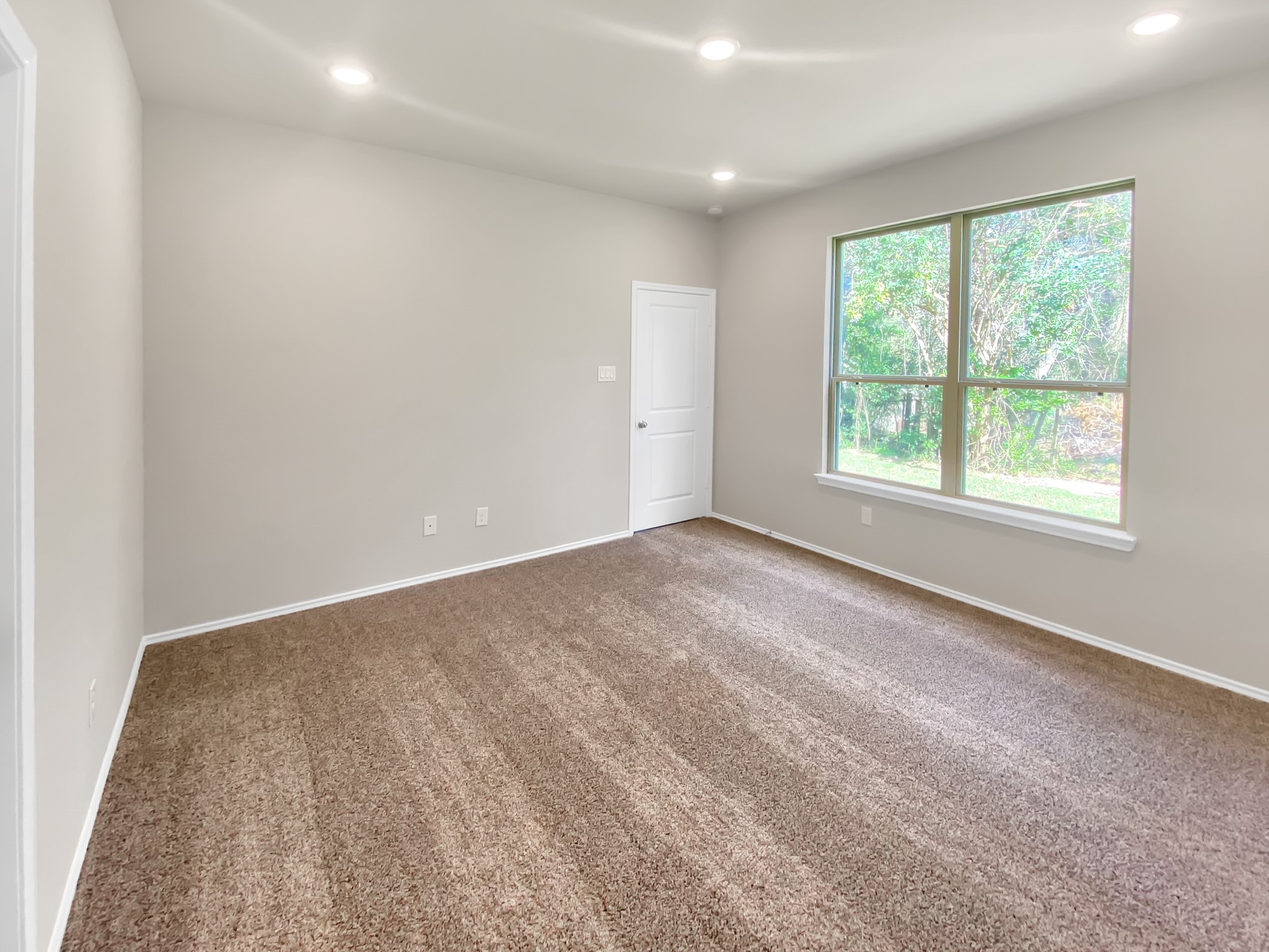 405 Mohawk Drive Conroe, TX 77316 - Photo 11 of 22 an empty room with a window