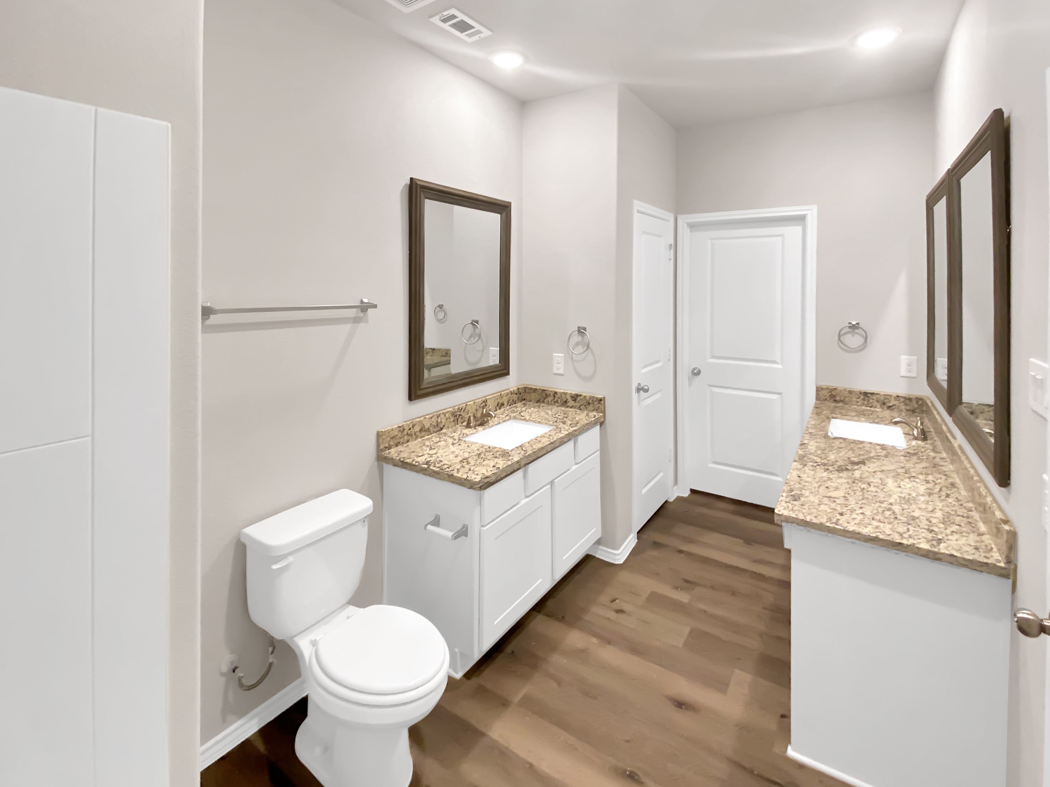 405 Mohawk Drive Conroe, TX 77316 - Photo 12 of 22 a bathroom with a granite countertop sink toilet and shower