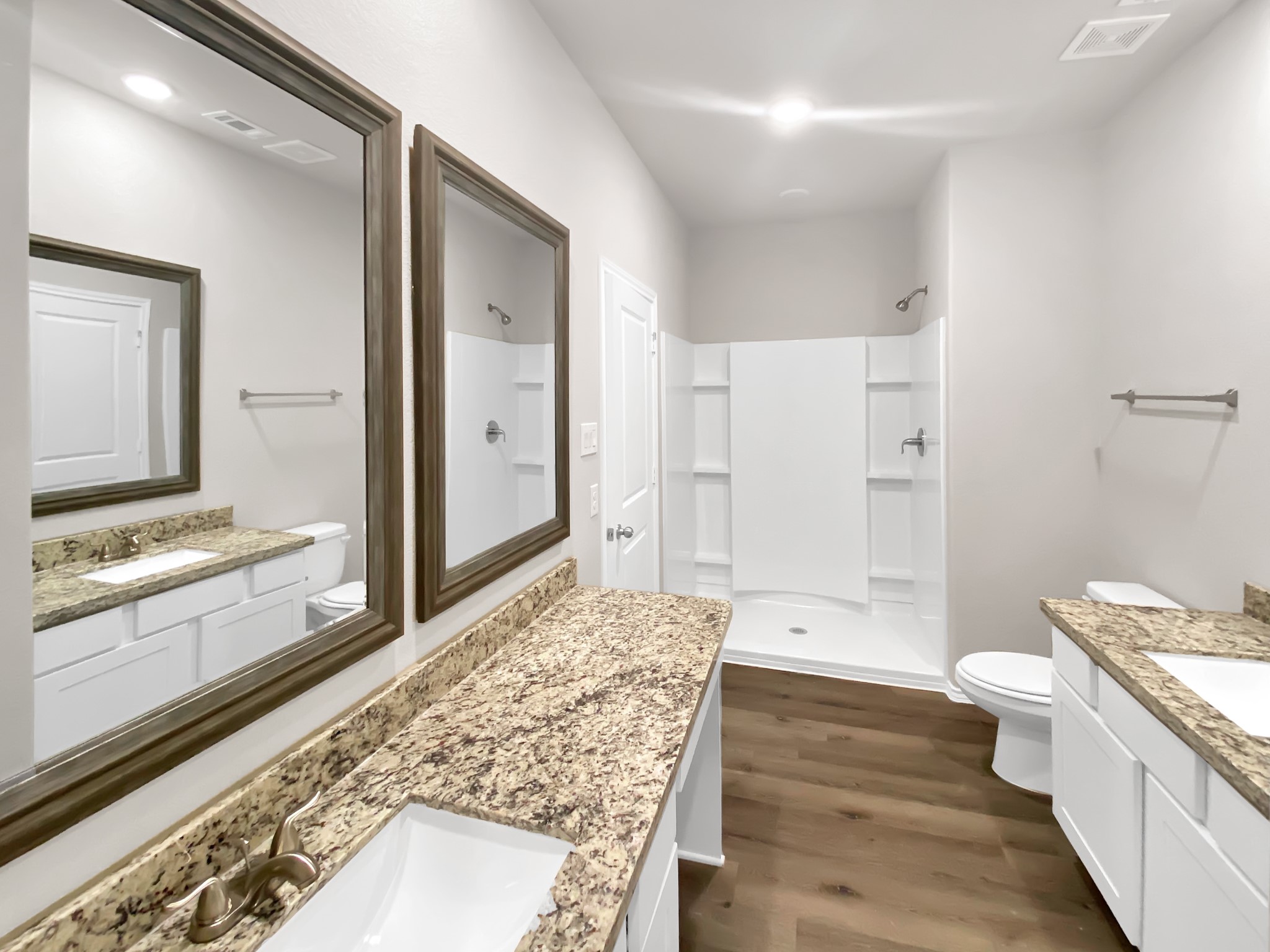 405 Mohawk Drive Conroe, TX 77316 - Photo 13 of 22 a spacious bathroom with a granite countertop sink and a large mirror
