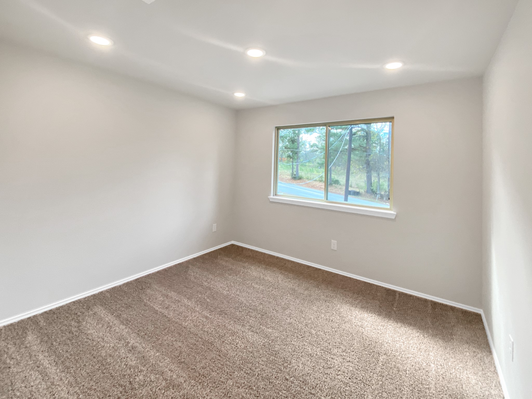 405 Mohawk Drive Conroe, TX 77316 - Photo 16 of 22 an empty room with windows