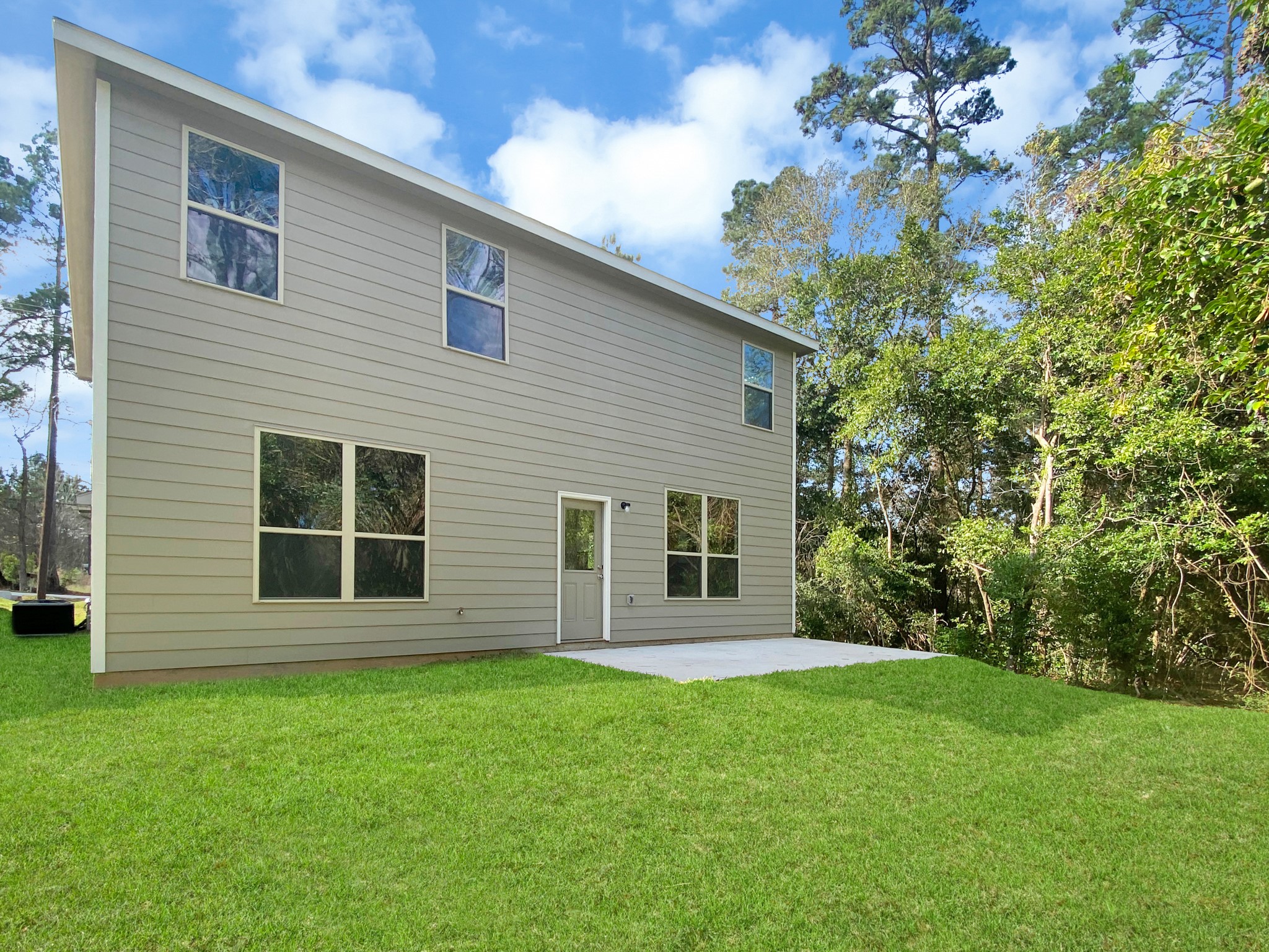 405 Mohawk Drive Conroe, TX 77316 - Photo 22 of 22 a view of house with backyard space and garden