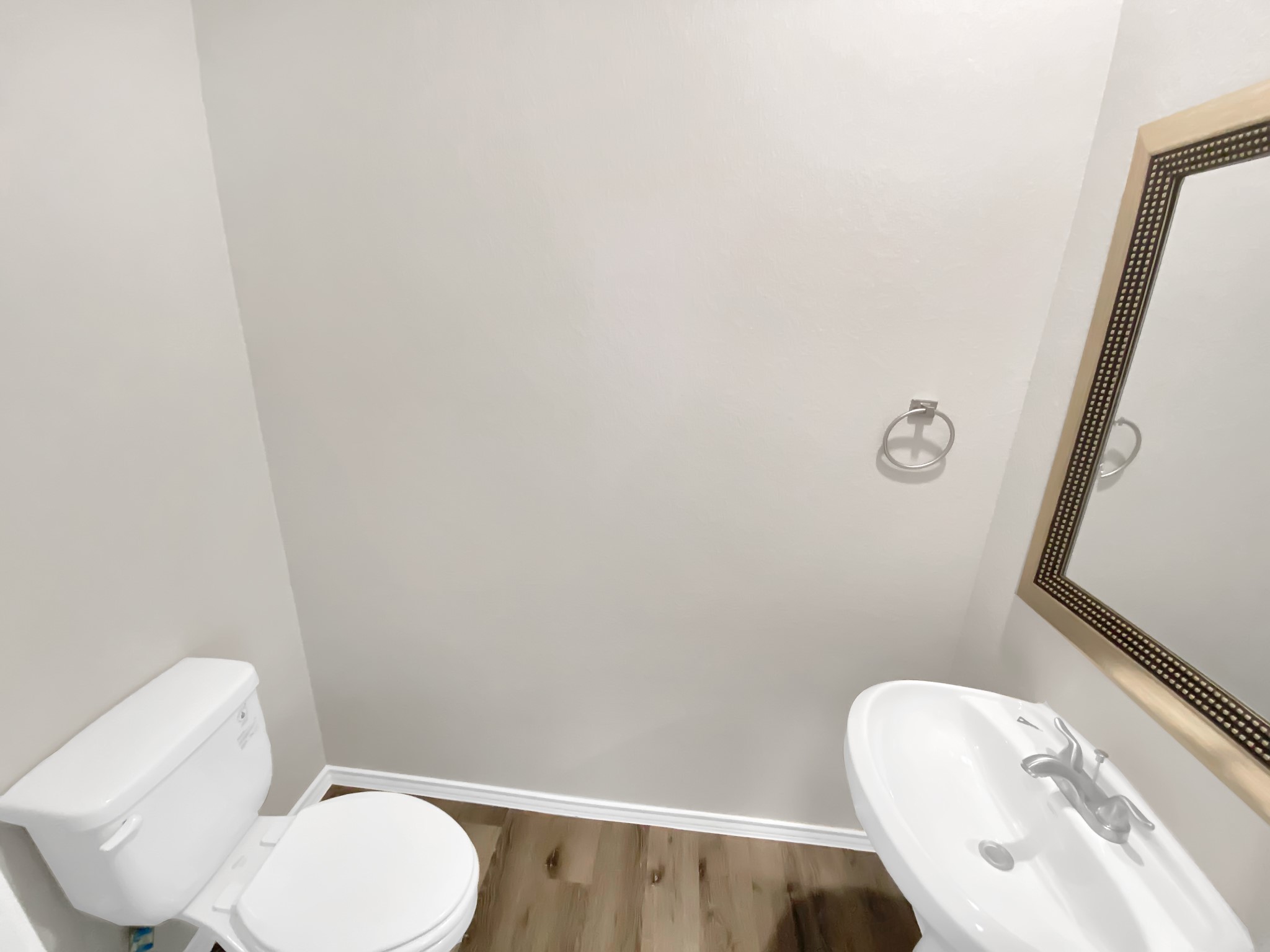 405 Mohawk Drive Conroe, TX 77316 - Photo 9 of 22 a white toilet sitting next to a bathroom sink