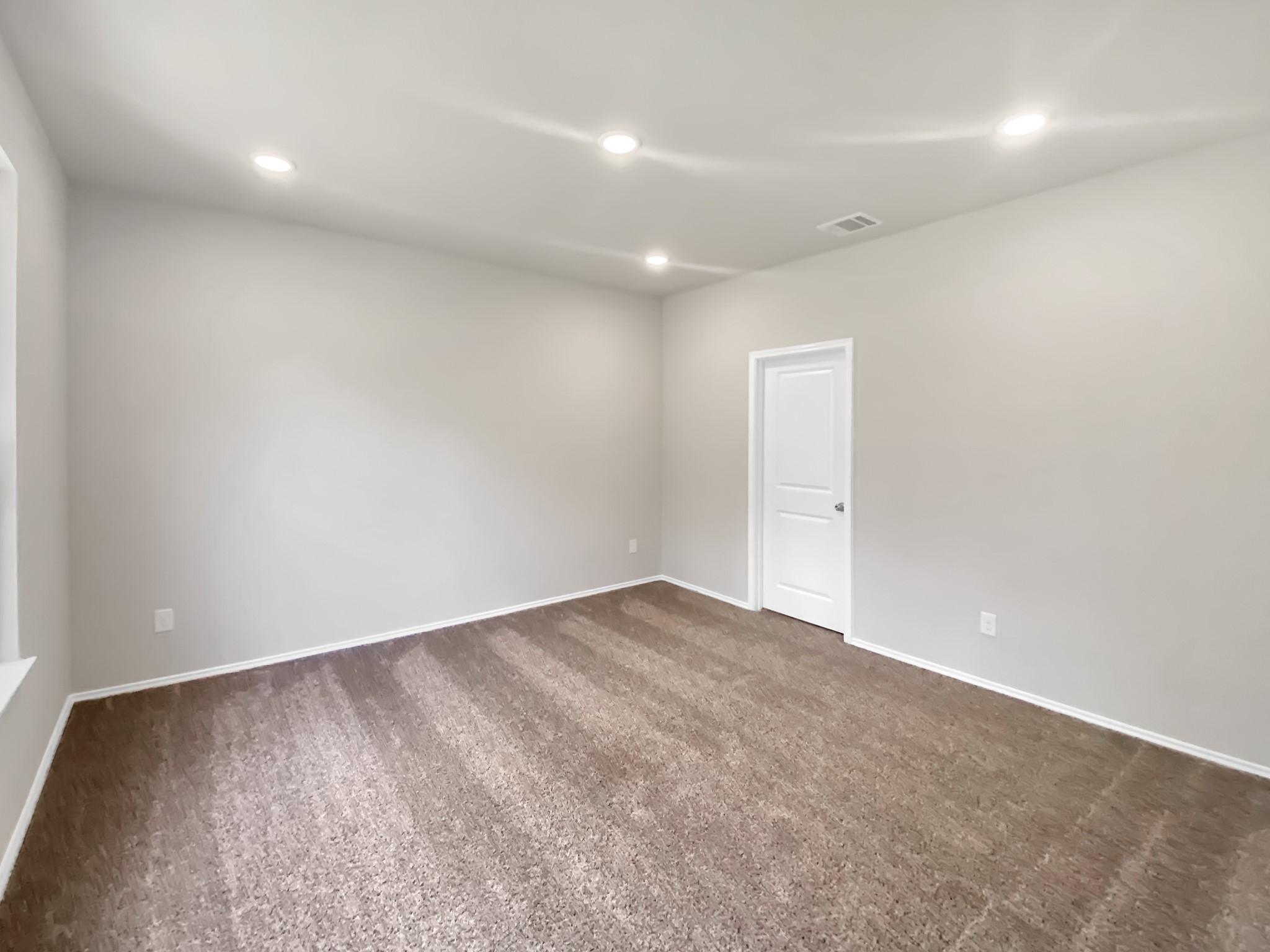 405 Mohawk Drive Conroe, TX 77316 - Photo 10 of 22 an empty room with a natural light