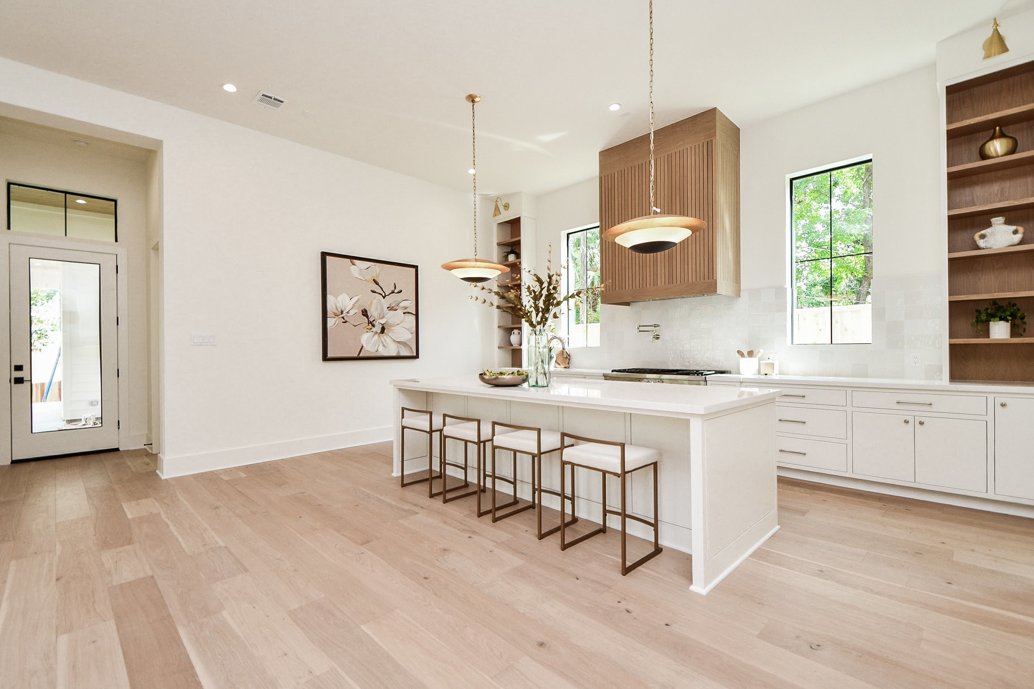 336 West 32nd Street Houston, TX 77018 - Photo 16 of 50 a kitchen with stainless steel appliances granite countertop a stove a sink dishwasher and a refrigerator with wooden floor