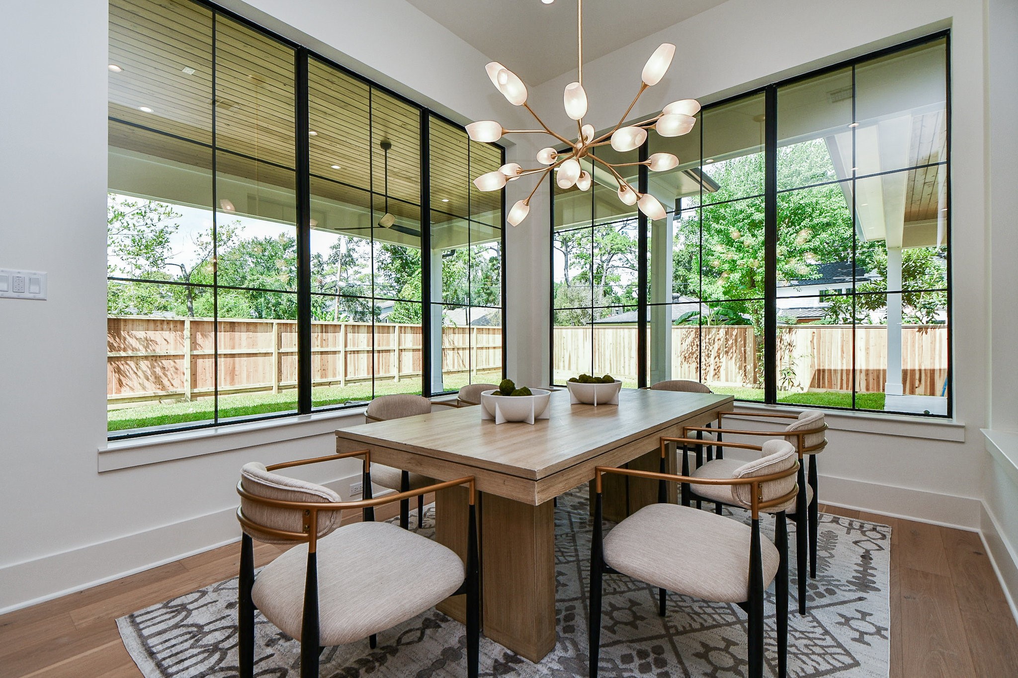 336 West 32nd Street Houston, TX 77018 - Photo 21 of 50 a dining room with furniture a chandelier and wooden floor