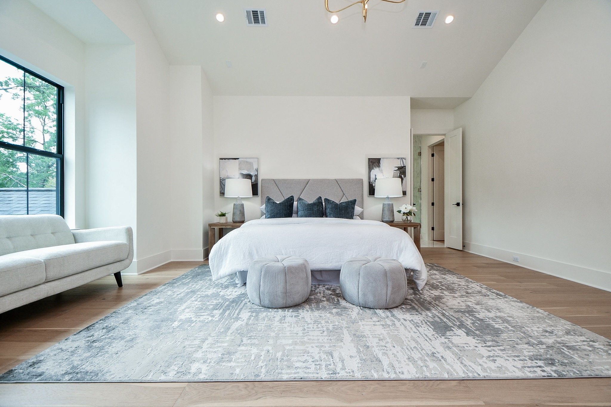 336 West 32nd Street Houston, TX 77018 - Photo 25 of 50 a bed sitting in a bedroom next to a window with a rug