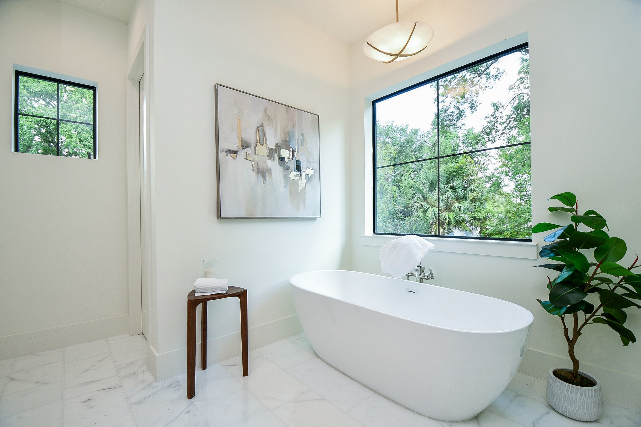 336 West 32nd Street Houston, TX 77018 - Photo 30 of 50 a white bath tub sitting next to a window