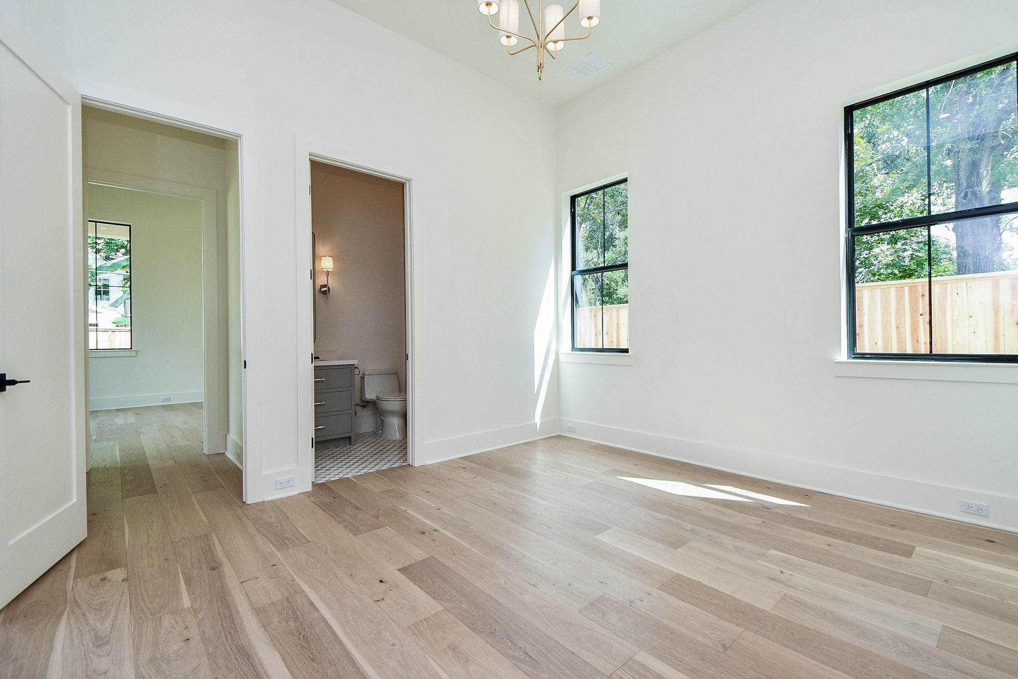 336 West 32nd Street Houston, TX 77018 - Photo 45 of 50 an empty room with wooden floor and windows