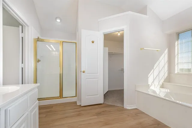 a view of entryway with window and wooden floor