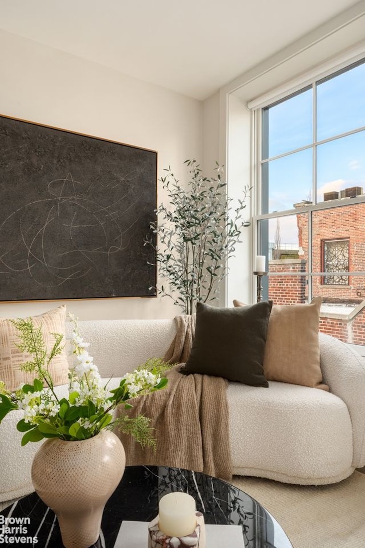 74 Grand Street, Unit PH Manhattan, NY 10013 - Photo 11 of 18 a living room with furniture and a potted plant