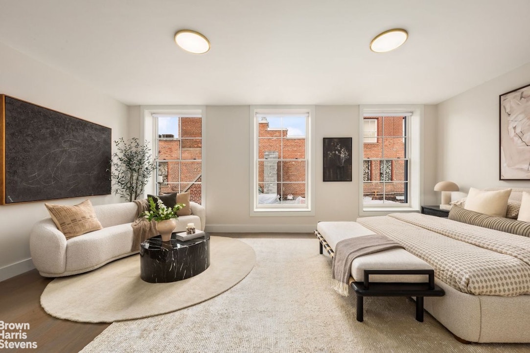 74 Grand Street, Unit PH Manhattan, NY 10013 - Photo 9 of 18 a living room with furniture and a flat screen tv