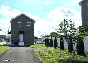 603 Florence Avenue, Unit 2 Union Beach, NJ 07735 - Photo 10 of 11 a house with trees in front of it