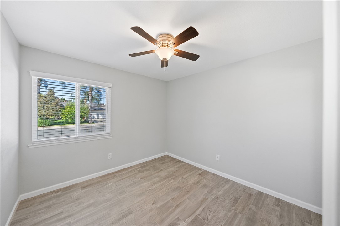3386 Somis Drive Riverside, CA 92507 - Photo 17 of 31 an empty room with a window and a ceiling fan