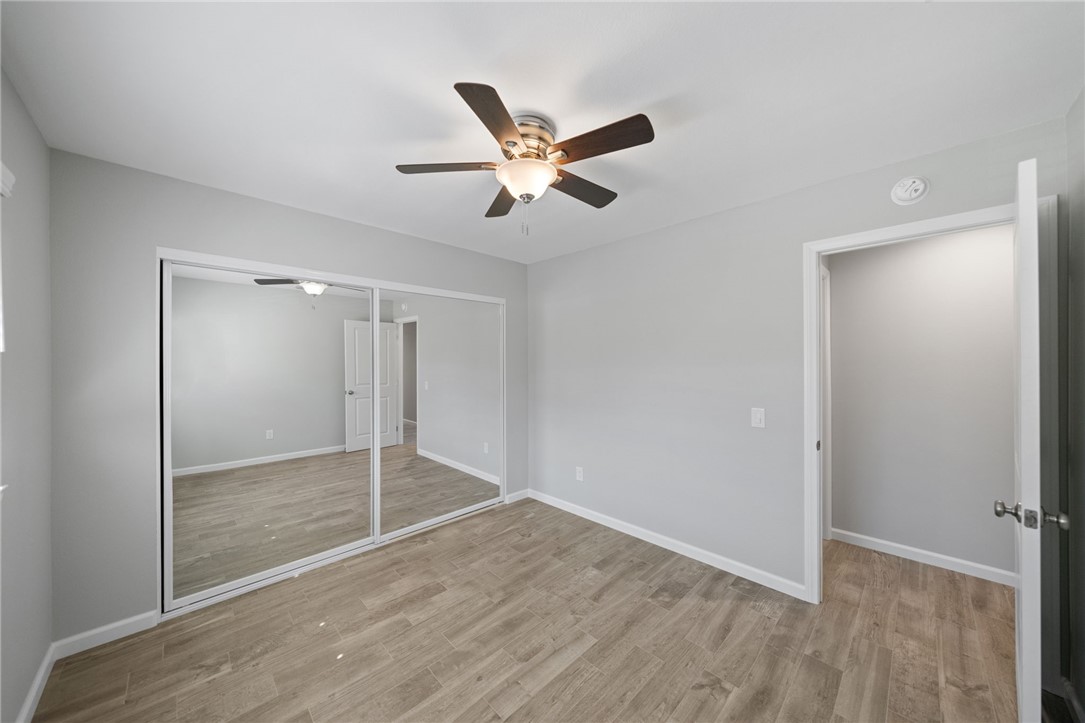 3386 Somis Drive Riverside, CA 92507 - Photo 19 of 31 a view of empty room with wooden floor and ceiling fan
