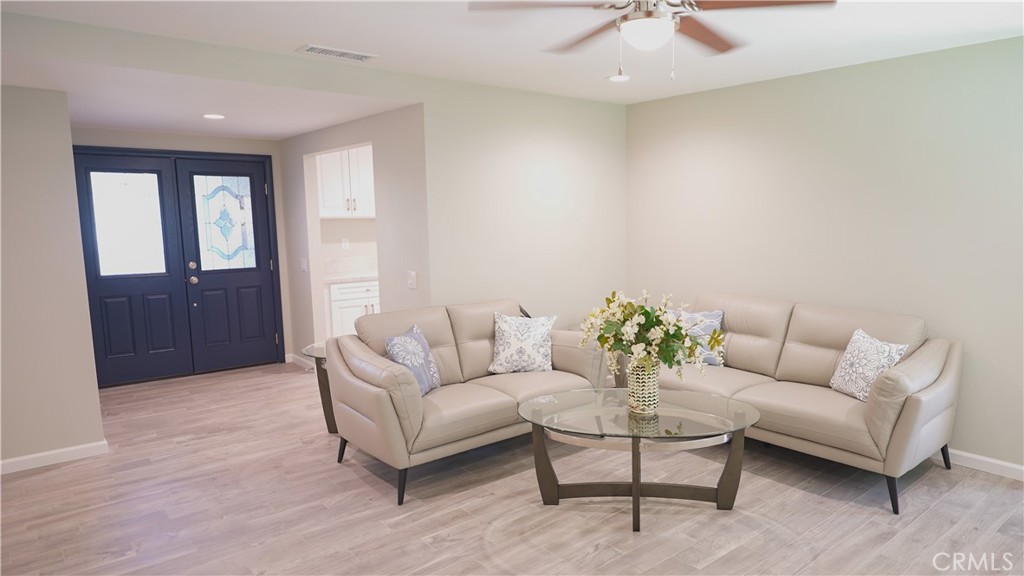 3386 Somis Drive Riverside, CA 92507 - Photo 4 of 31 a living room with furniture and a chandelier