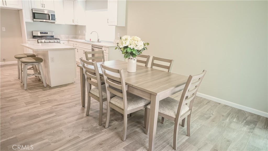 3386 Somis Drive Riverside, CA 92507 - Photo 6 of 31 a dining room with furniture and wooden floor