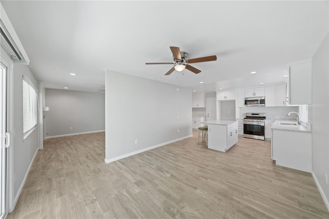 3386 Somis Drive Riverside, CA 92507 - Photo 8 of 31 a view of a kitchen with wooden floor and a window