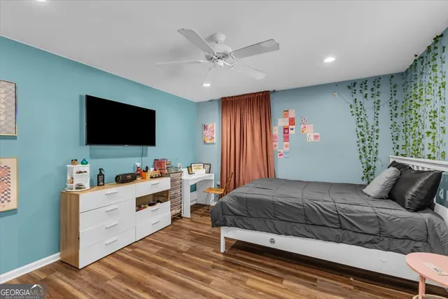 a bedroom with a bed and a view of bathroom