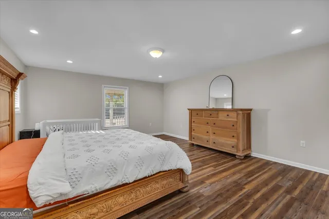 a bathroom with a sink a mirror and shower