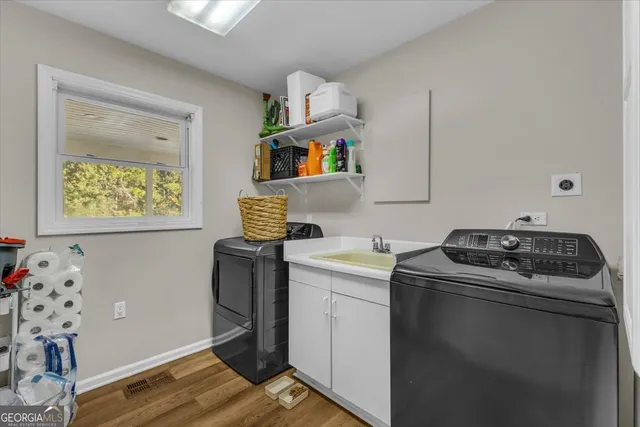 a bathroom with a sink toilet and a mirror