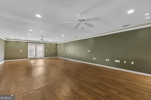 a spacious bedroom with a bed and a window