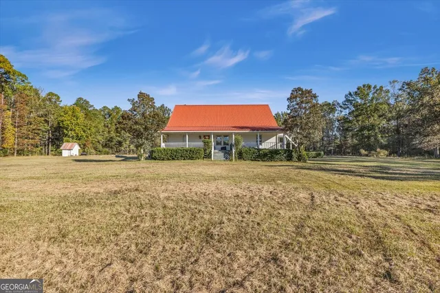 a view of swimming pool with a yard