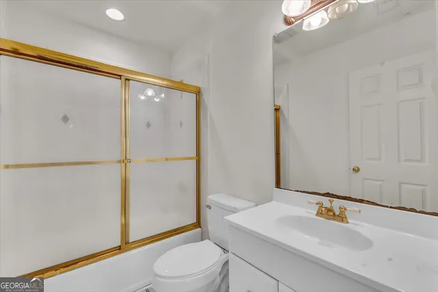 a view of a green yard with large trees