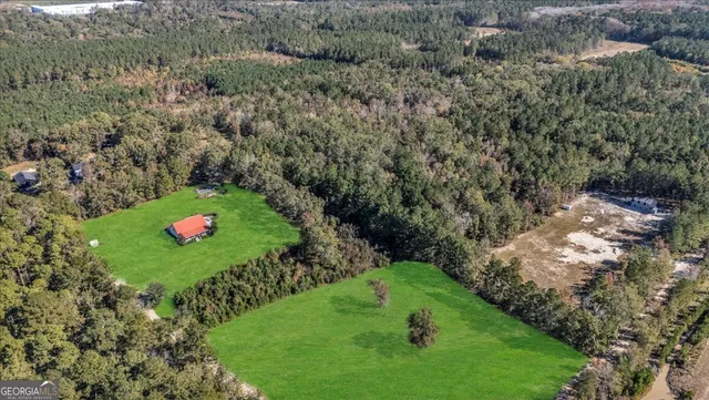a aerial view of a house with a yard