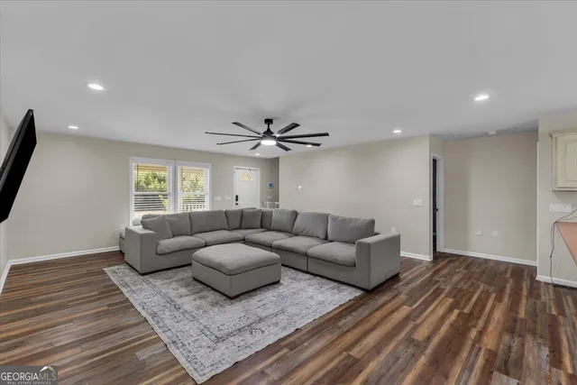 a living room with furniture and a rug