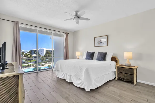 a bedroom with a bed and a night stand