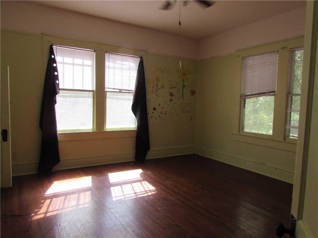 1003 Carswell Avenue Waycross, GA 31503 - Photo 14 of 25 Bedrooms have hardwood floors and beautiful large windows.