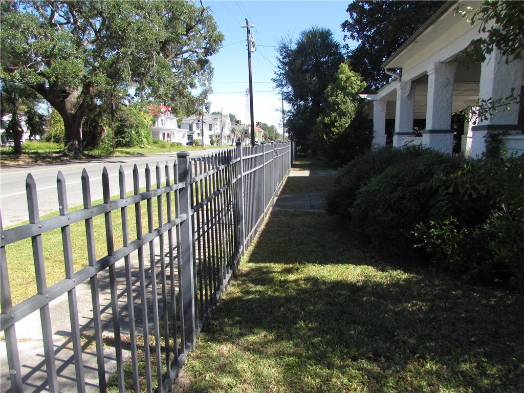 1003 Carswell Avenue Waycross, GA 31503 - Photo 2 of 25 Nice fencing surrounds the whole lot.